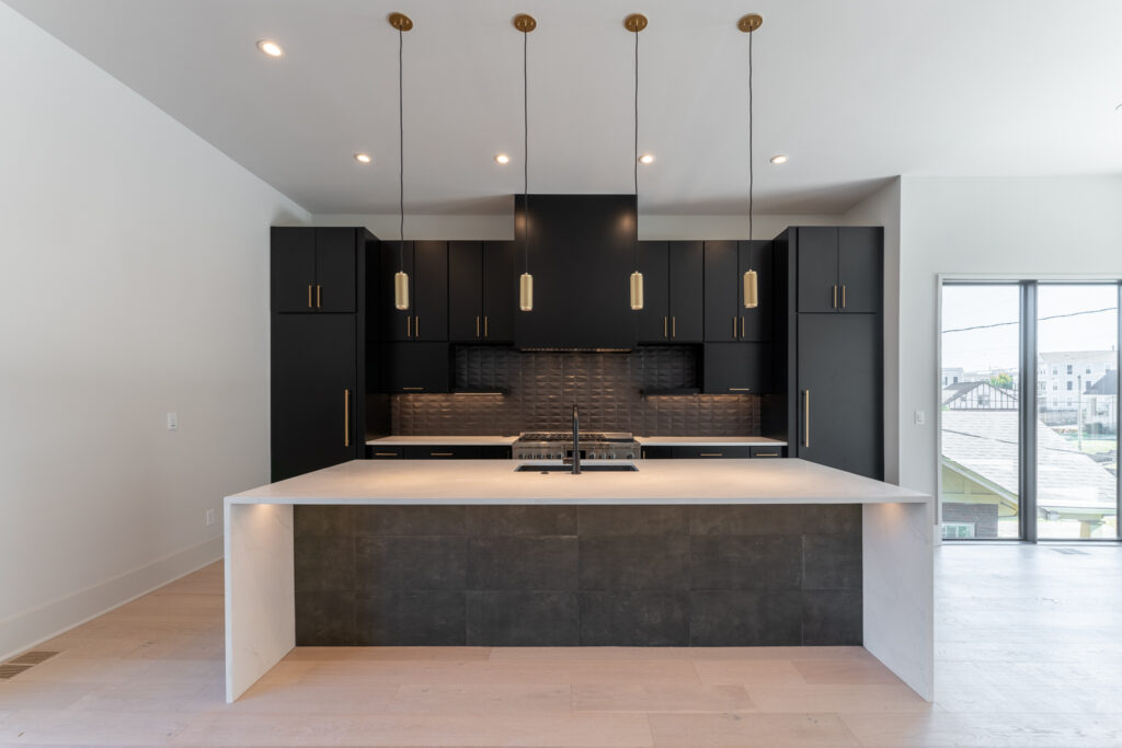 3122 A Belwood - by Rainer Schuertzmann-40 kitchen with large island with dark cabinets and light floors